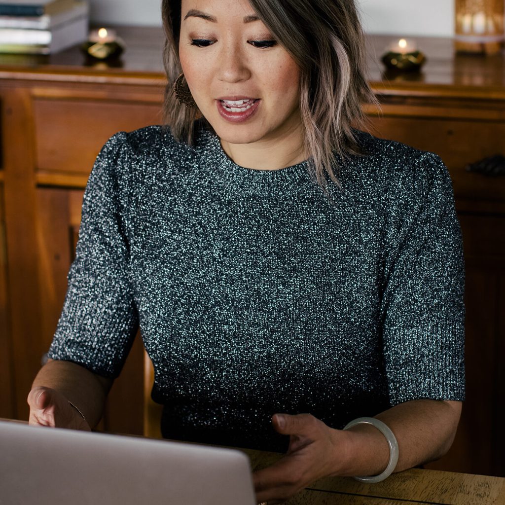 Dr Jin Ong Coaching Emotional Release Techniques online from her macbook